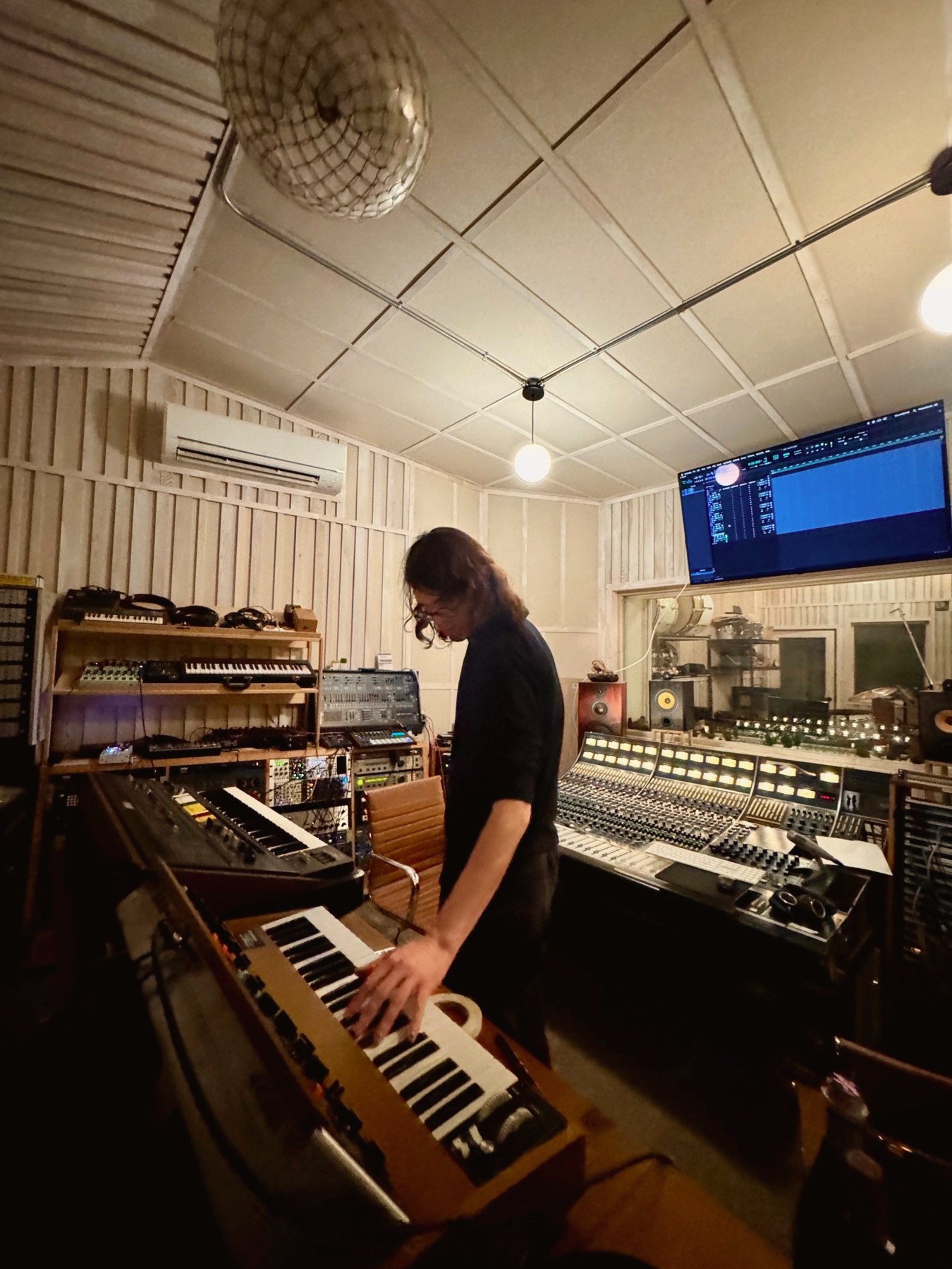 Control room with the Neve 8058, synths and Theo at a Minimoog